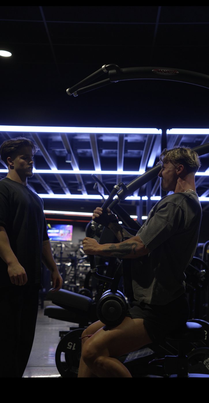 Jye Wilson coaching a client in the gym